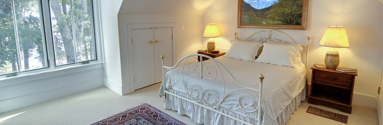 Casement window style utilized in a bedroom.