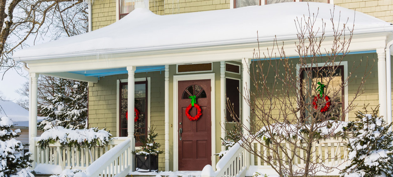 House in the winter with a storm door.