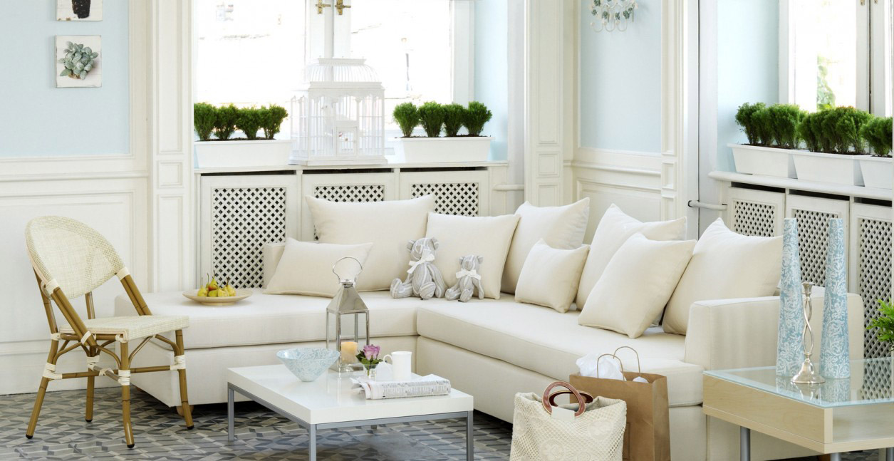 A modern living room with four large PVC casement windows.