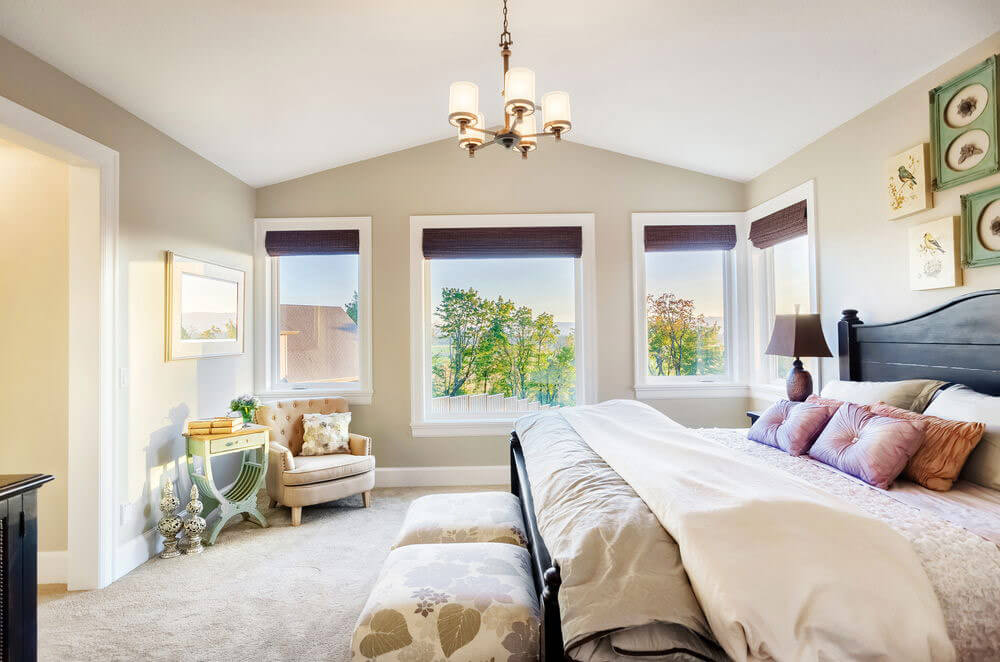 Beautiful bedroom with three large casement windows.