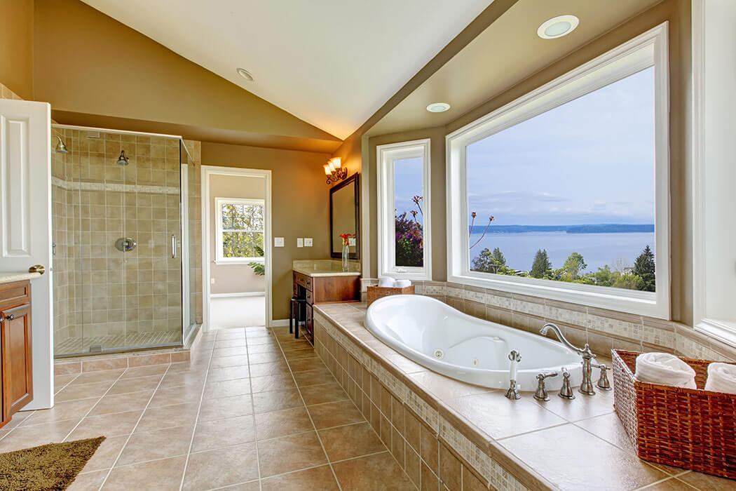 A modern bathroom with a large white pvc bay window over it.