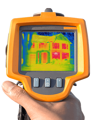 A thermocamera pointing at a house that is losing heat through the windows.