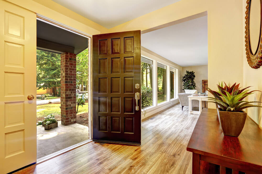 A chestnut door slab opened up on a modern home.