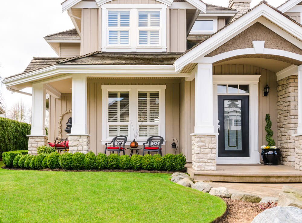 Home with modern black steel entry door