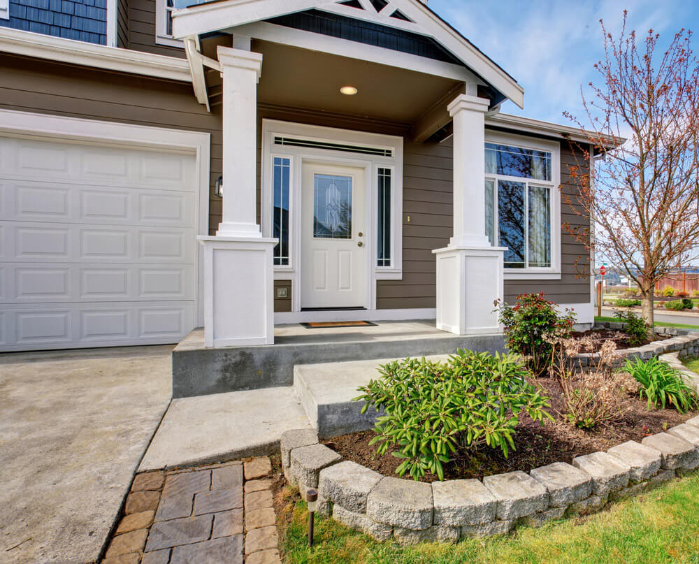 Modern entry door system with custom door trim and added sidelites and transoms.